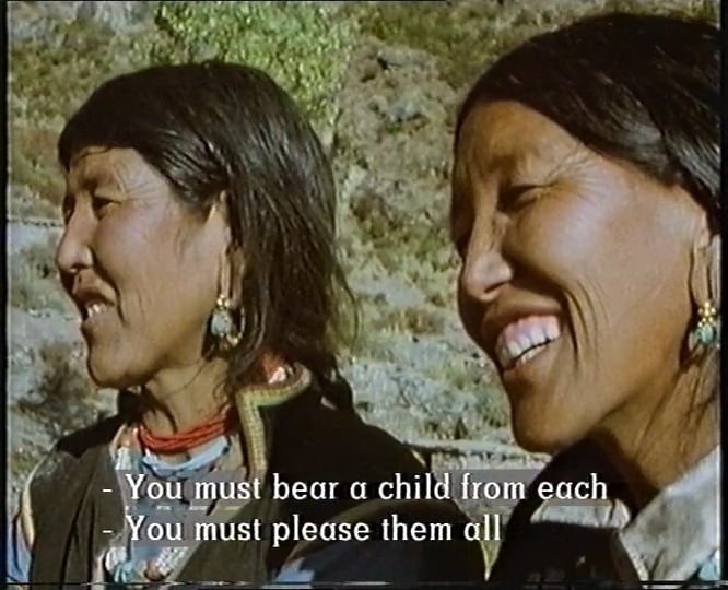 Two Nepali women in traditional dress - subtitle reads 'you must bear a child from each - you must please them all'